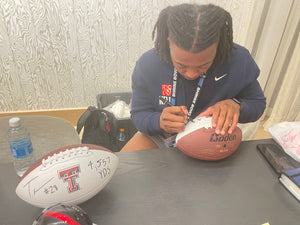 Tahj Brooks autographed items with career yardage inscription